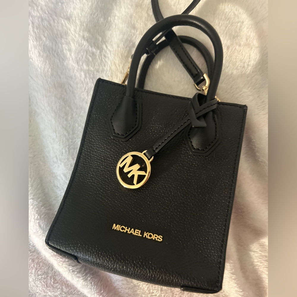 Michael Kors Black leather handbag with crossbody strap and gold accents
